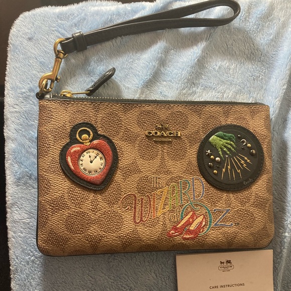 coach wizard of oz wristlet